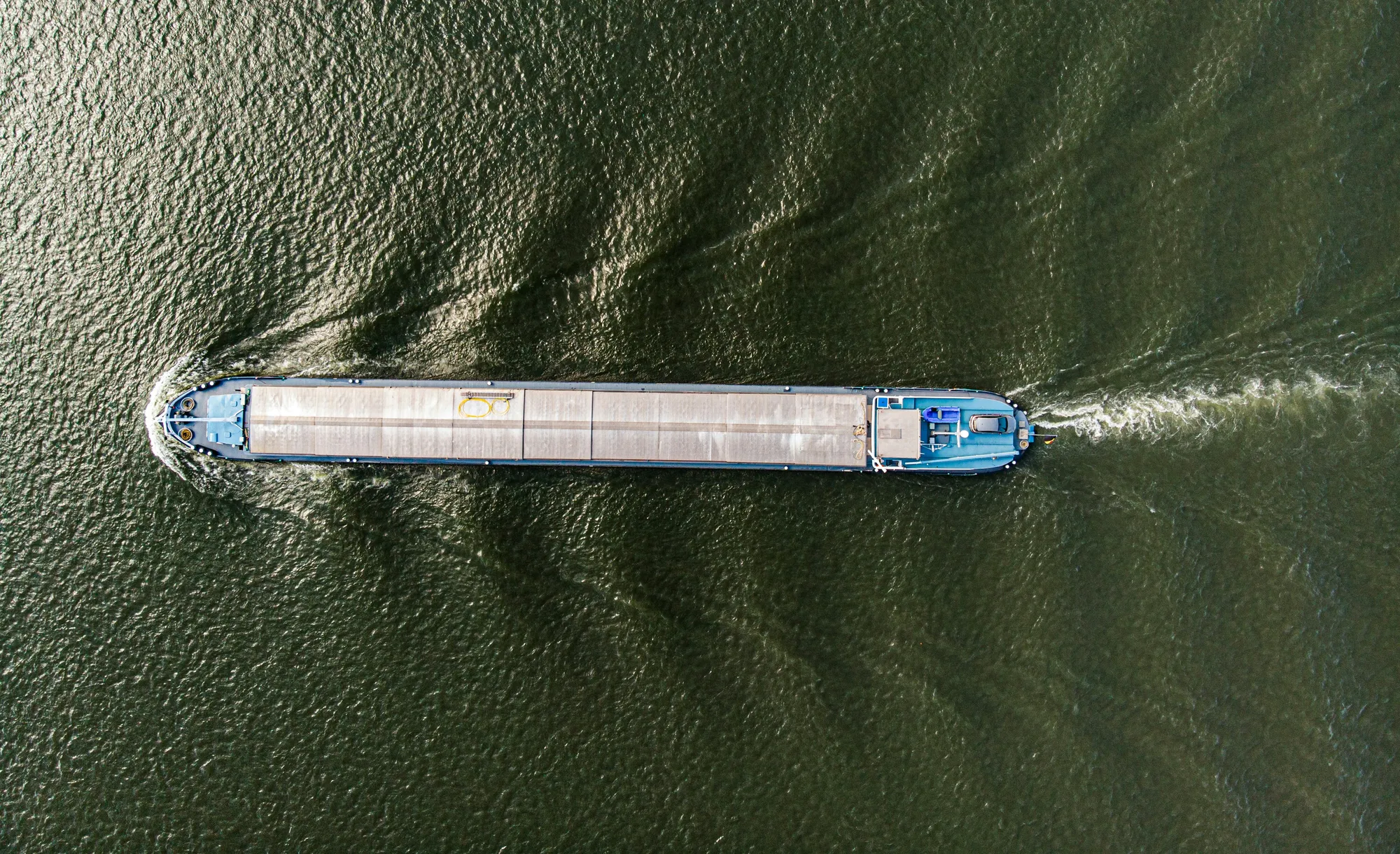 Aerial view of a cargo barge on an inland waterway