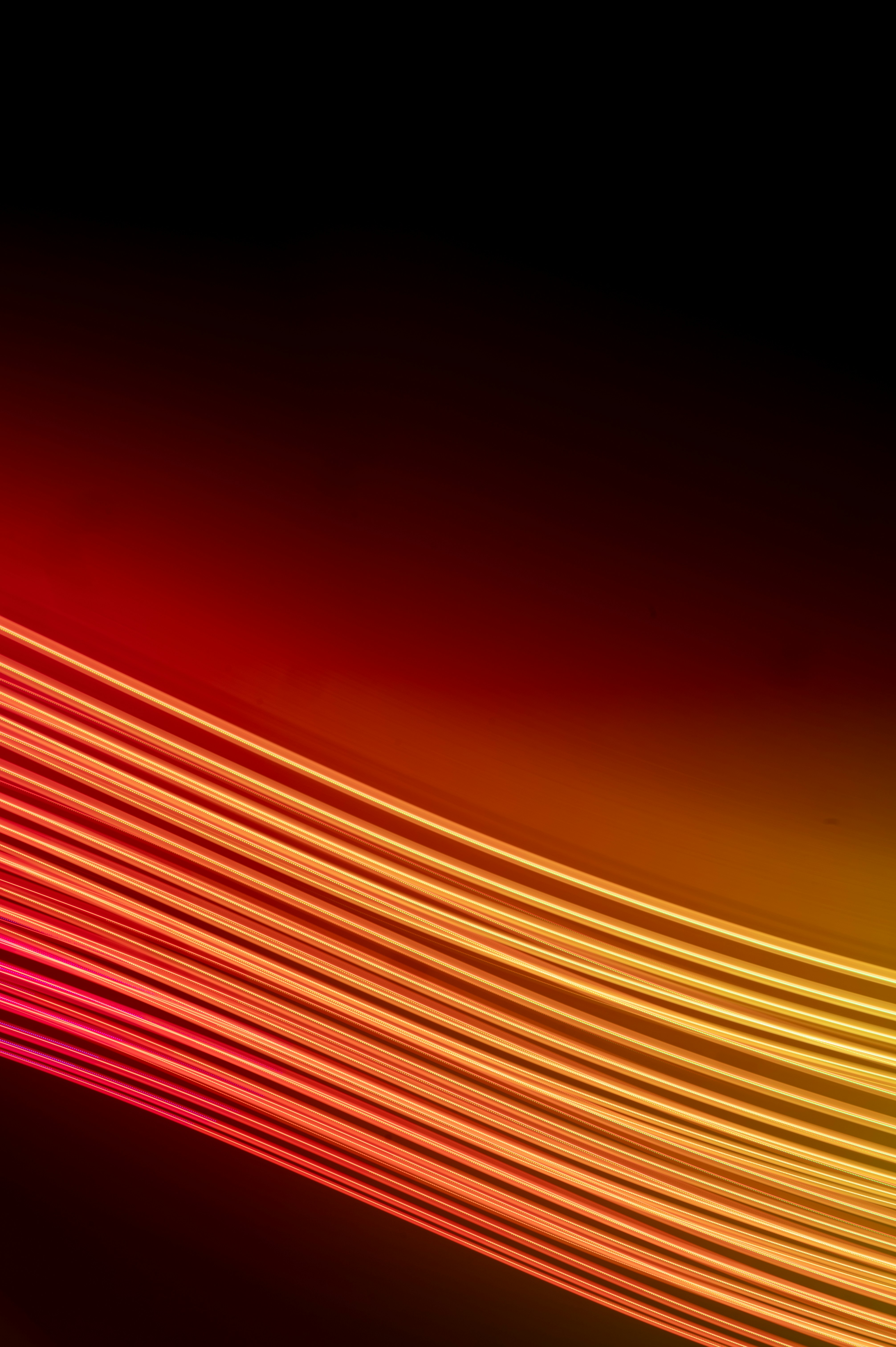 Diagonal orange and red light streaks across a dark background — fast-moving numbers