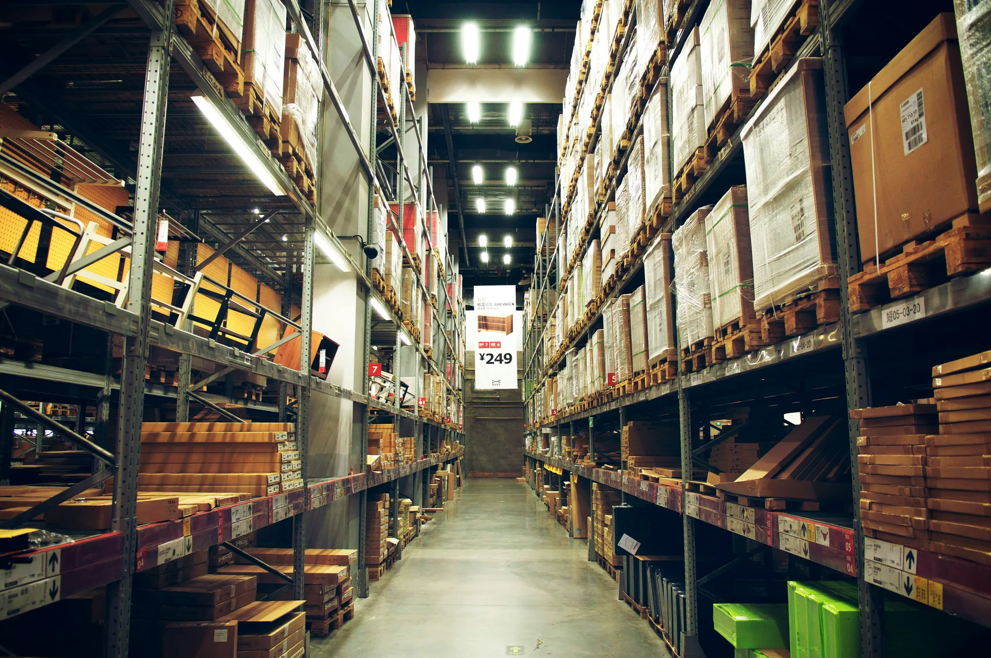 Retail warehouse aisle stacked with mixed products